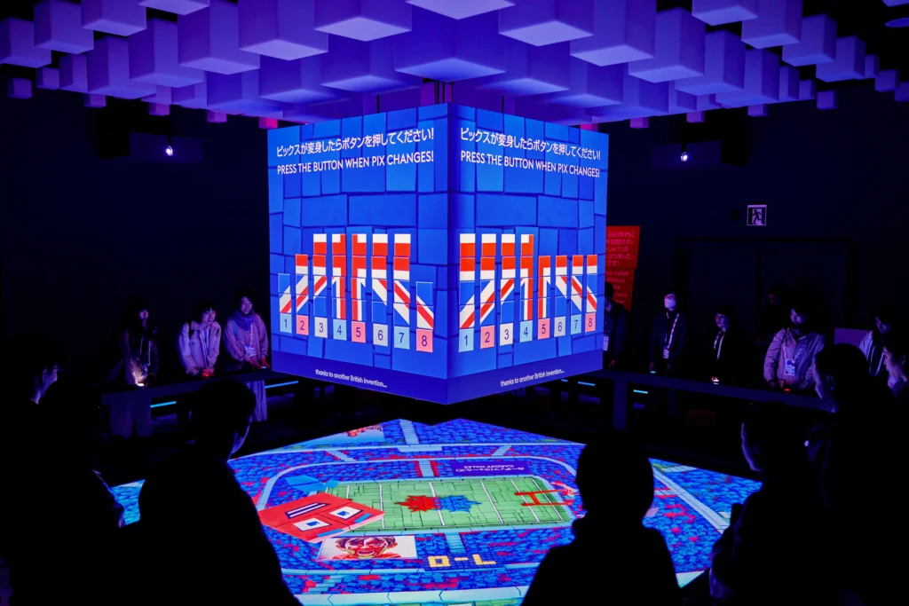 Visitors at the UK Pavilion's immersive experience